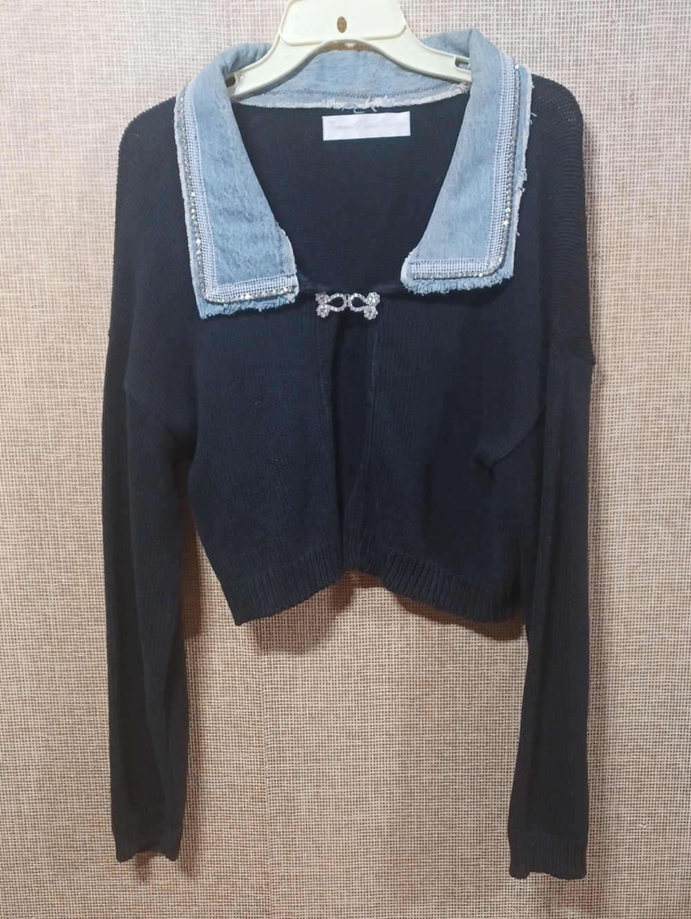 Black Cropped Cardigan with Light Blue Trim and Crystal Brooch